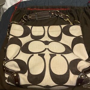 A brown and cream vintage Coach